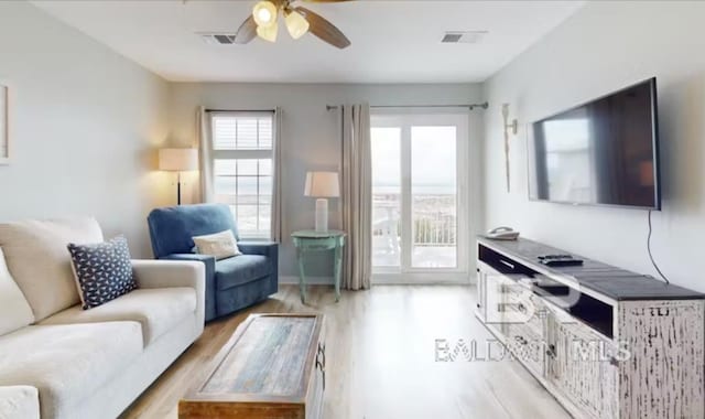 572 E Beach Blvd Unit 318, Gulf Shores, AL 36542 - living area featuring a ceiling fan and light wood-style floors