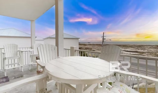 572 E Beach Blvd Unit 318, Gulf Shores, AL 36542 - wooden deck featuring a water view and outdoor dining area