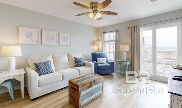 572 E Beach Blvd Unit 318, Gulf Shores, AL 36542 - living room featuring a ceiling fan and light wood-style floors