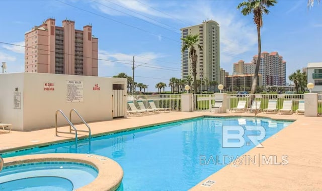 572 E Beach Blvd Unit 318, Gulf Shores, AL 36542 - community pool with a patio area and a community hot tub