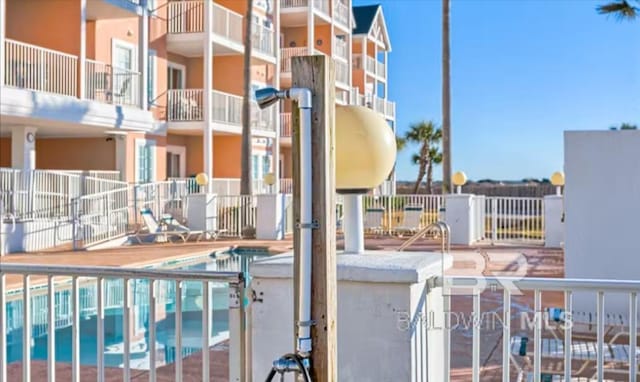 572 E Beach Blvd Unit 318, Gulf Shores, AL 36542 - balcony featuring view of pool area