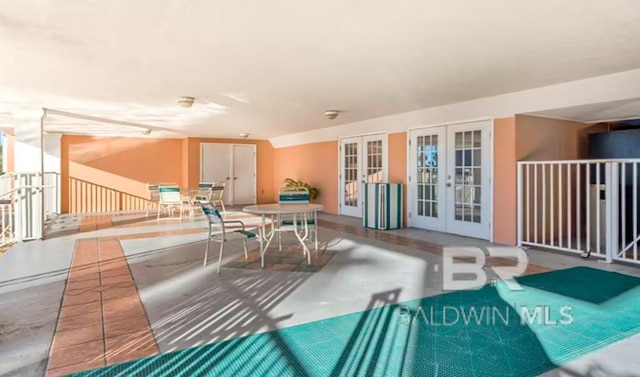 572 E Beach Blvd Unit 318, Gulf Shores, AL 36542 - interior space featuring french doors and finished concrete floors