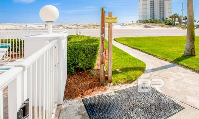 572 E Beach Blvd Unit 318, Gulf Shores, AL 36542 - surrounding community with a lawn