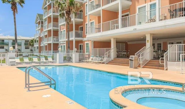 572 E Beach Blvd Unit 318, Gulf Shores, AL 36542 - community pool with a patio area and a community hot tub