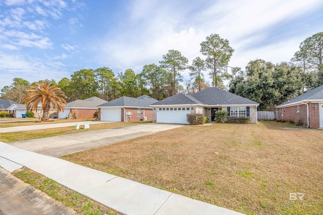 ranch-style house featuring a garage and a front yard