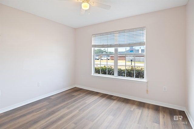 empty room featuring hardwood / wood-style floors and ceiling fan