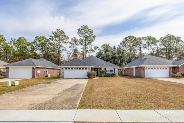 ranch-style home with a garage and a front lawn