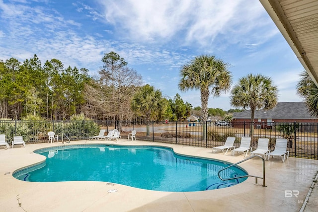 view of swimming pool featuring a patio area