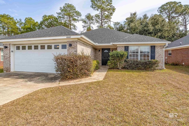 ranch-style home featuring a garage and a front lawn