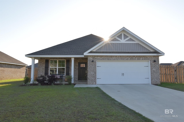 1123 Pheasant Cir, Foley, AL 36535 - craftsman house featuring brick siding, fence, driveway, and a front yard