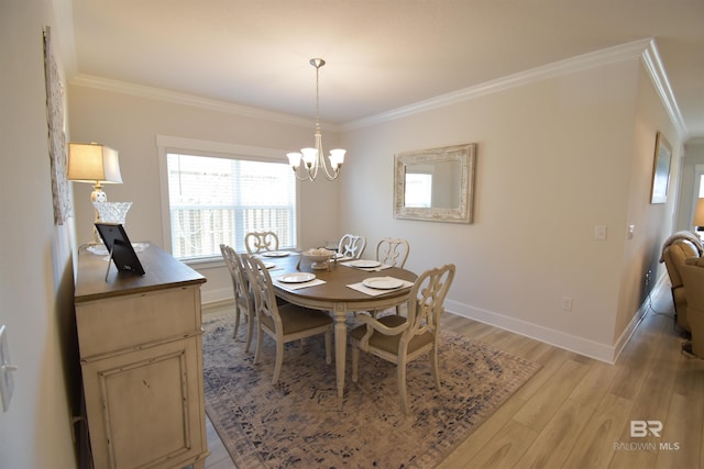 1123 Pheasant Cir, Foley, AL 36535 - dining room with light wood-type flooring, ornamental molding, baseboards, and a chandelier