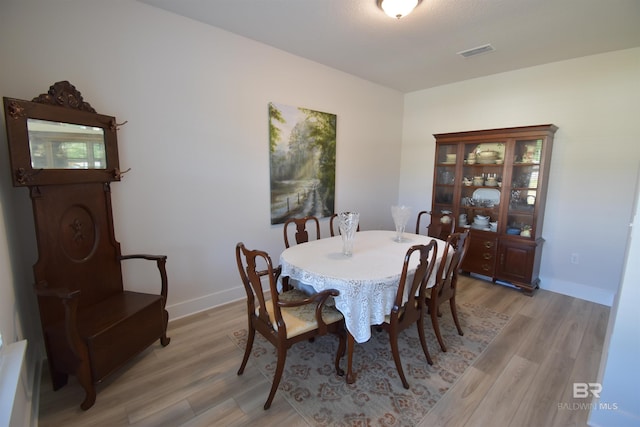 1123 Pheasant Cir, Foley, AL 36535 - dining space with baseboards, visible vents, and light wood-style flooring