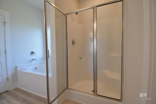 1123 Pheasant Cir, Foley, AL 36535 - full bath featuring a shower stall, wood finished floors, and a bath