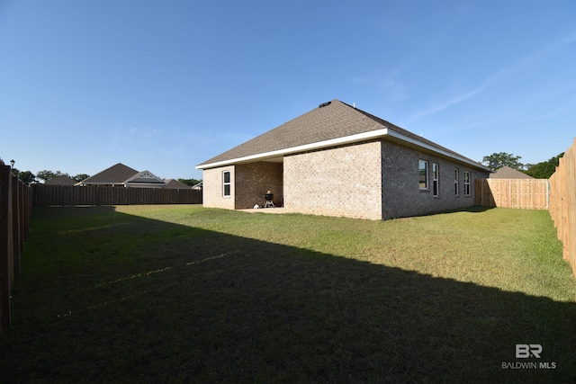 1123 Pheasant Cir, Foley, AL 36535 - exterior space featuring a lawn, a fenced backyard, and brick siding