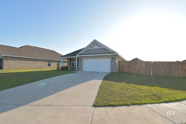 1123 Pheasant Cir, Foley, AL 36535 - view of front of property with fence, brick siding, a garage, a front yard, and concrete driveway