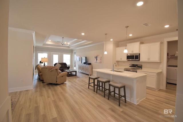 1123 Pheasant Cir, Foley, AL 36535 - kitchen featuring crown molding, visible vents, open floor plan, washer / clothes dryer, and stainless steel appliances