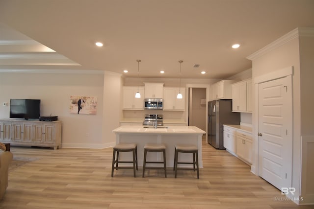 1123 Pheasant Cir, Foley, AL 36535 - kitchen with recessed lighting, ornamental molding, a breakfast bar area, and stainless steel appliances