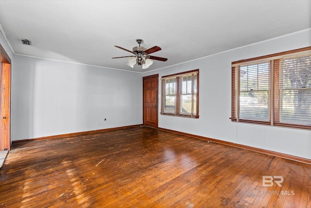 unfurnished room with dark hardwood / wood-style floors, ceiling fan, and crown molding