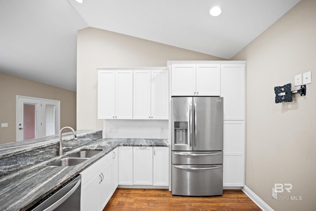10210 Lyttleton Loop, Lillian, AL 36549 - kitchen with a sink, lofted ceiling, stainless steel appliances, and stone counters