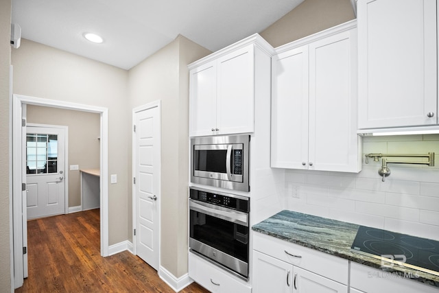 10210 Lyttleton Loop, Lillian, AL 36549 - kitchen featuring white cabinets, decorative backsplash, and stainless steel appliances