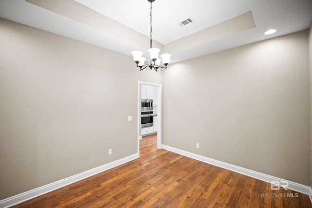 10210 Lyttleton Loop, Lillian, AL 36549 - unfurnished room with recessed lighting, baseboards, an inviting chandelier, visible vents, and wood finished floors