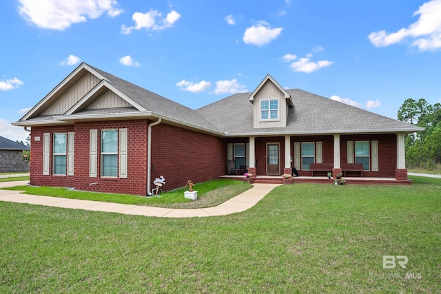 10210 Lyttleton Loop, Lillian, AL 36549 - view of front facade featuring a front lawn, brick siding, and board and batten siding