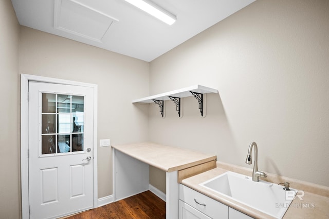 10210 Lyttleton Loop, Lillian, AL 36549 - laundry room featuring a sink, baseboards, and dark wood-style floors