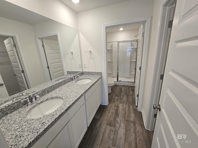 14530 Dayton Cir, Foley, AL 36535 - full bath featuring wood finished floors, a stall shower, toilet, double vanity, and a spacious closet