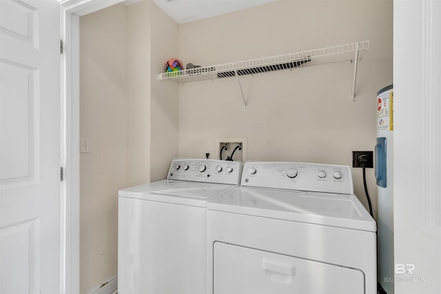 laundry room featuring separate washer and dryer and laundry area