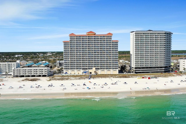 birds eye view of property with a view of the beach and a water view