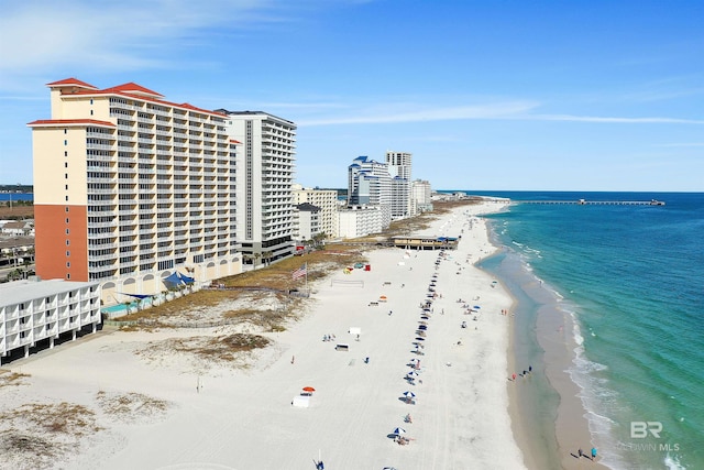 aerial view with a city view, a beach view, and a water view