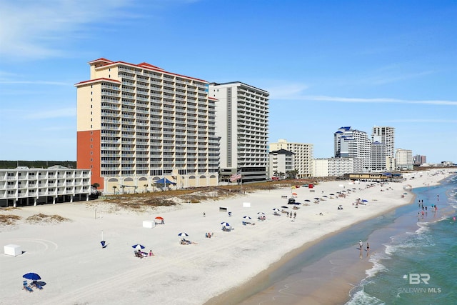 exterior space with a view of city, a water view, and a view of the beach