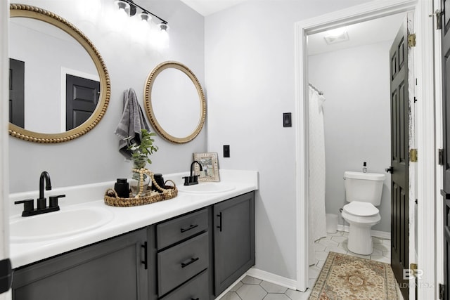 full bathroom with toilet, double vanity, tile patterned flooring, baseboards, and a shower with shower curtain