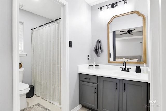 full bathroom with vanity, toilet, and tile patterned floors