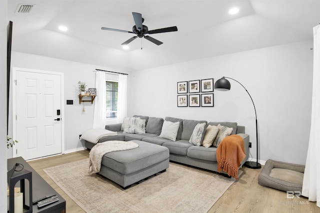 living area featuring wood finished floors, a ceiling fan, recessed lighting, and baseboards