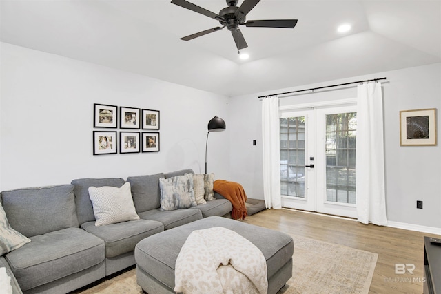 living room featuring recessed lighting, light wood-type flooring, a ceiling fan, and baseboards