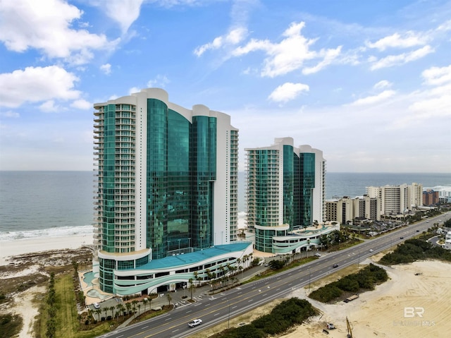 birds eye view of property with a city view and a water view