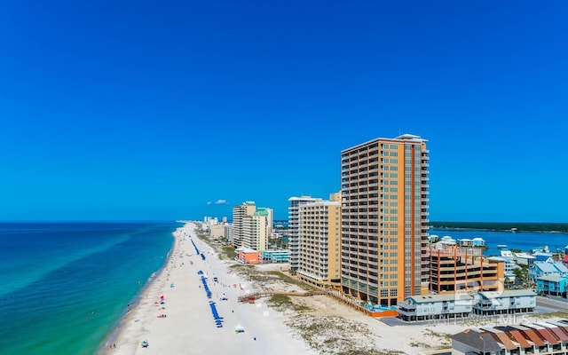 birds eye view of property with a city view, a view of the beach, and a water view