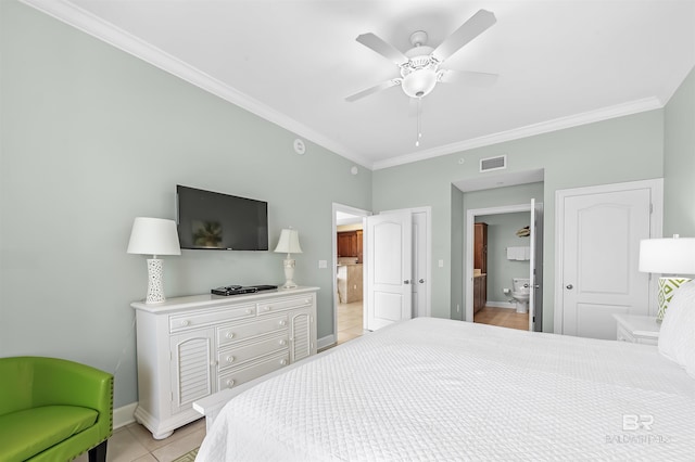 bedroom with ensuite bath, baseboards, visible vents, and ornamental molding