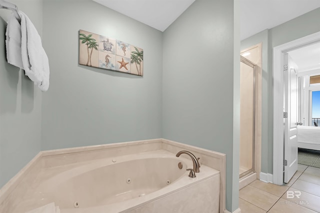 full bathroom with a tub with jets, ensuite bath, a shower stall, and tile patterned flooring