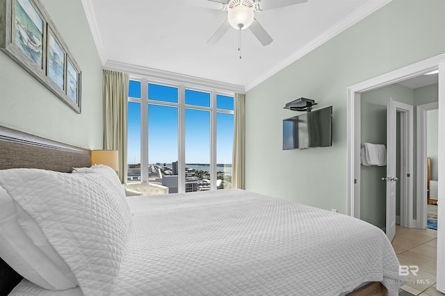 tiled bedroom with crown molding and ceiling fan