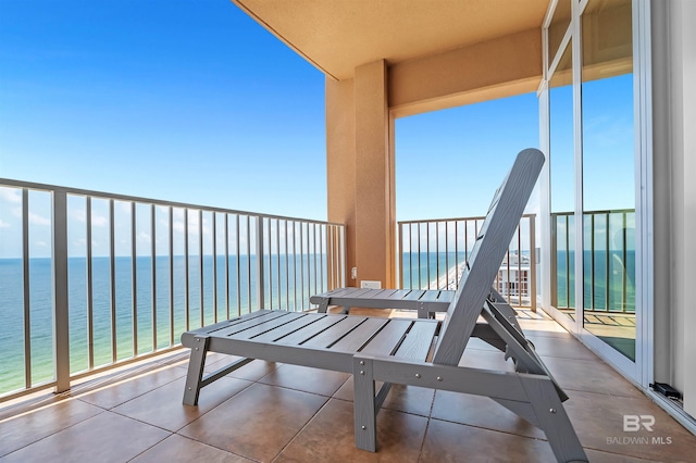 balcony featuring a water view