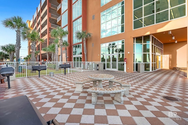 view of patio featuring grilling area and fence