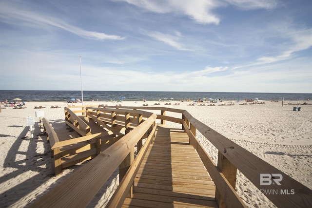 exterior space with a beach view and a water view