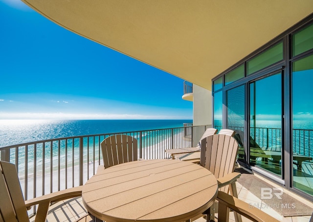 balcony with a beach view and a water view