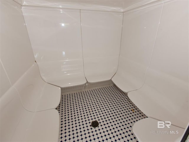 bathroom with toilet and walk in shower