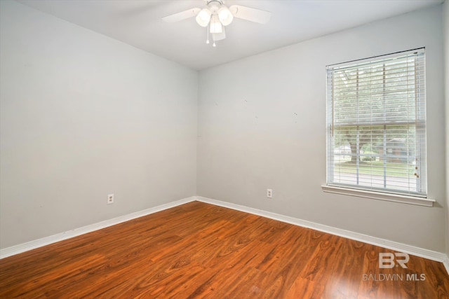 5175 W Somerset Dr, Mobile, AL 36619 - unfurnished room with baseboards, wood finished floors, and a ceiling fan