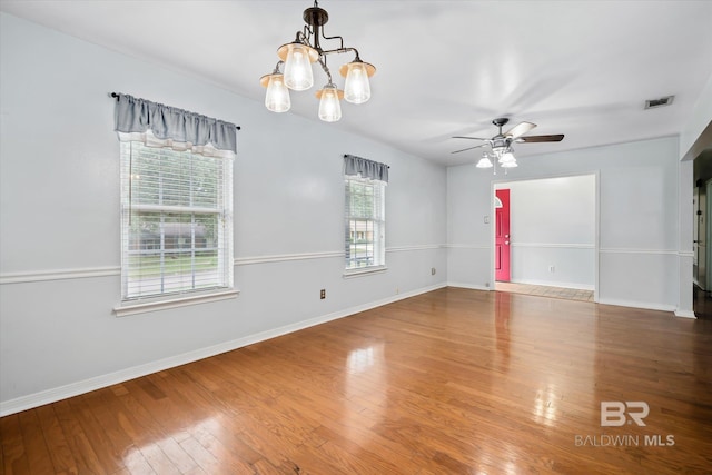 5175 W Somerset Dr, Mobile, AL 36619 - empty room featuring ceiling fan, a chandelier, baseboards, and wood finished floors