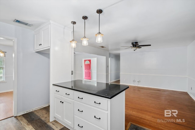 5175 W Somerset Dr, Mobile, AL 36619 - kitchen featuring ceiling fan, dark countertops, white cabinetry, dark wood finished floors, and decorative light fixtures