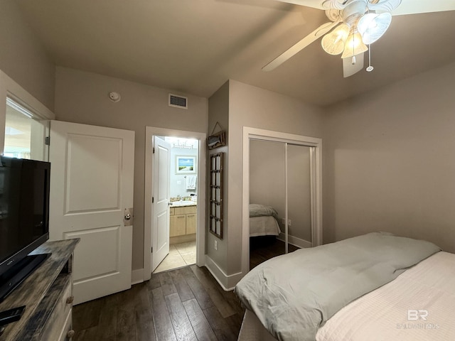 28105 Perdido Beach Blvd Unit C211, Orange Beach, AL 36561 - bedroom with ensuite bathroom, dark wood finished floors, a closet, visible vents, and a sink